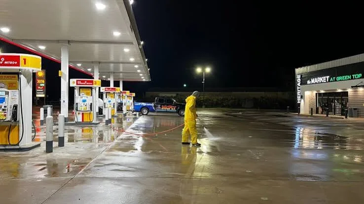 Sample: gas station forecourt pressure washing at night