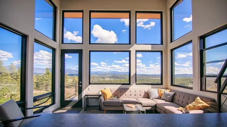 Sample: Living room with floor-to-ceiling windows overlooking the mountains