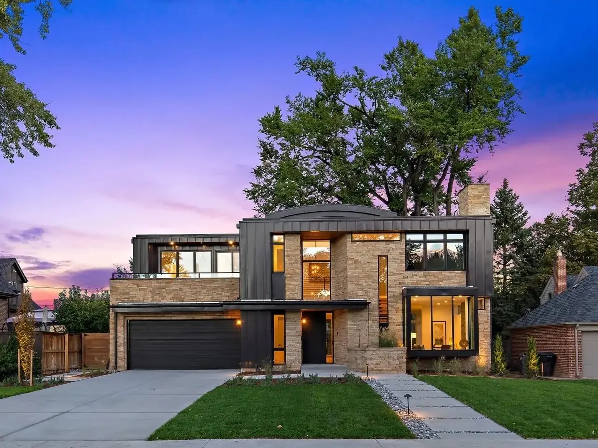 Sample: Modern two-story home at dusk with lit windows